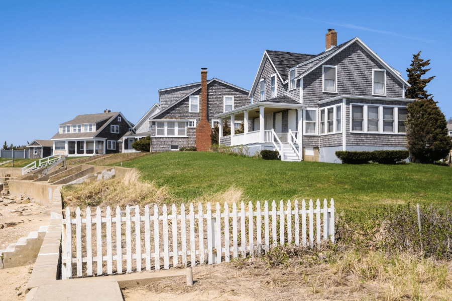 coastal cottages on the beach with chimneys and lots of windows